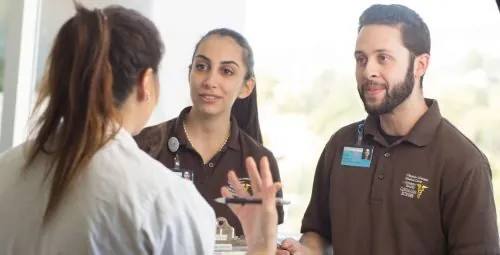 Health Scholars learning from a healthcare professional