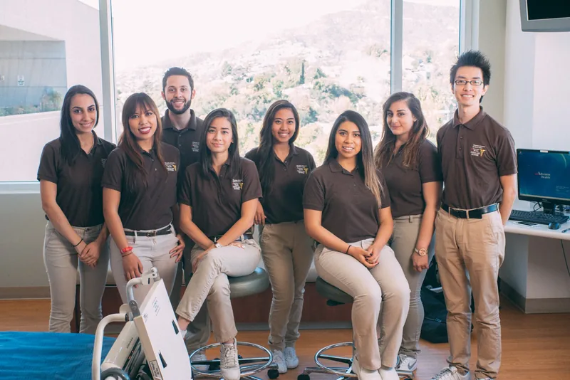 COPE Health Scholars participants gathered in a clinical learning setting