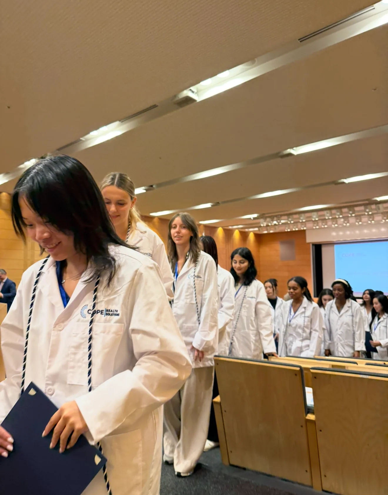 Japan International Health Scholar Intensive white coat cohort moment in a lecture hall
